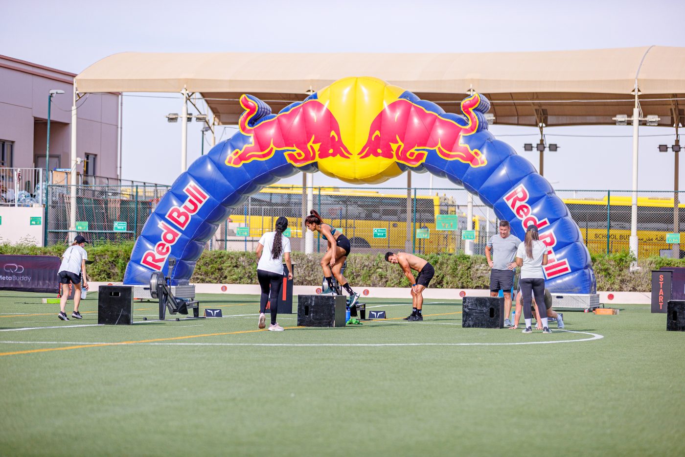 Athletes working through the stations on a Primal race floor