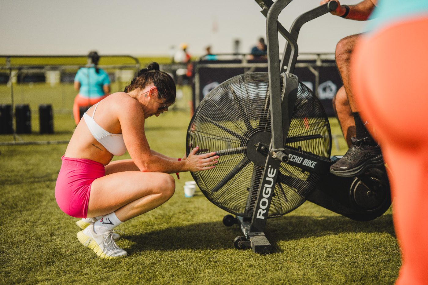 An athlete recovering beside the echo bike at a Primal race