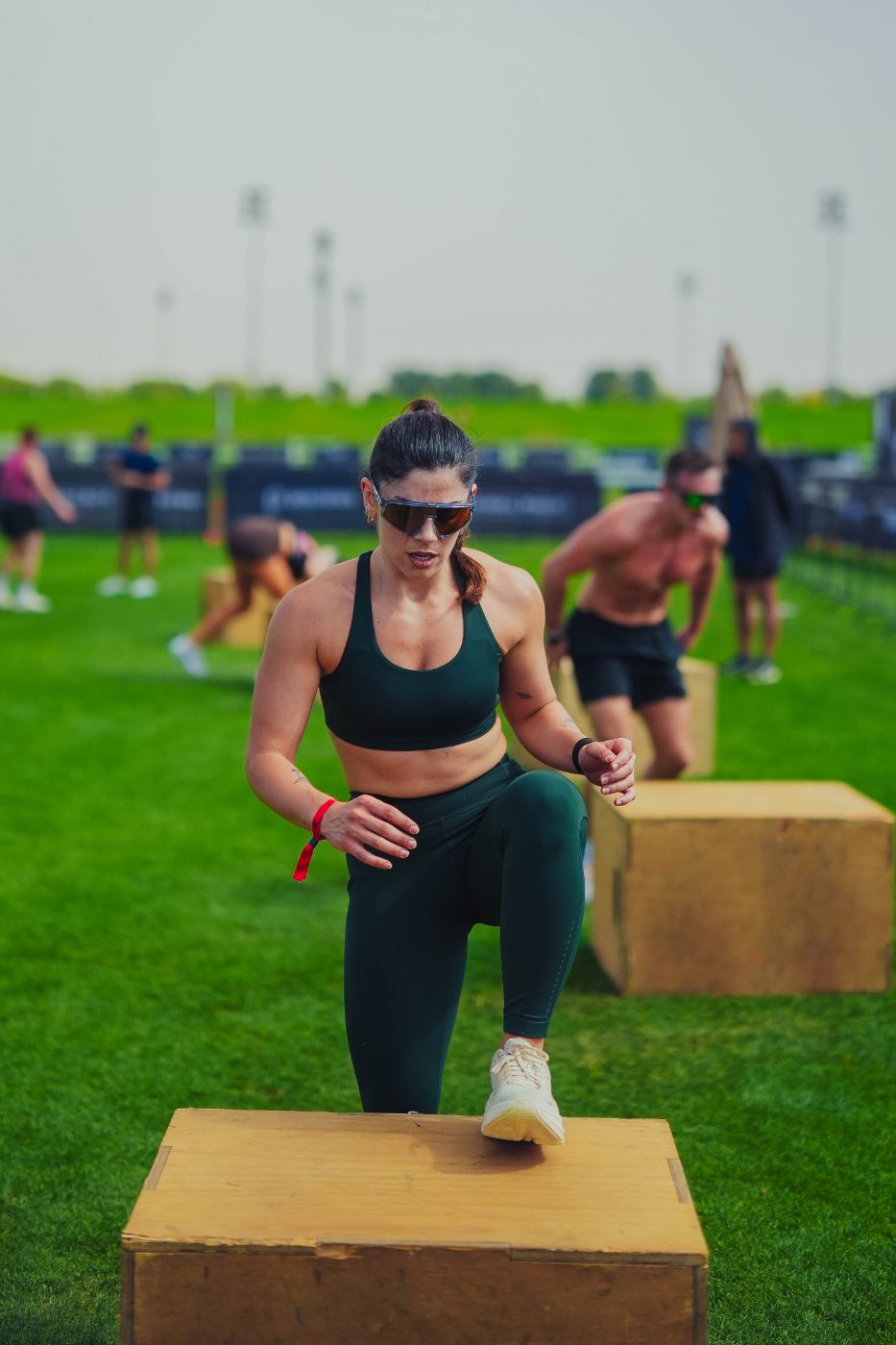 An athlete stepping onto the box at a Primal race